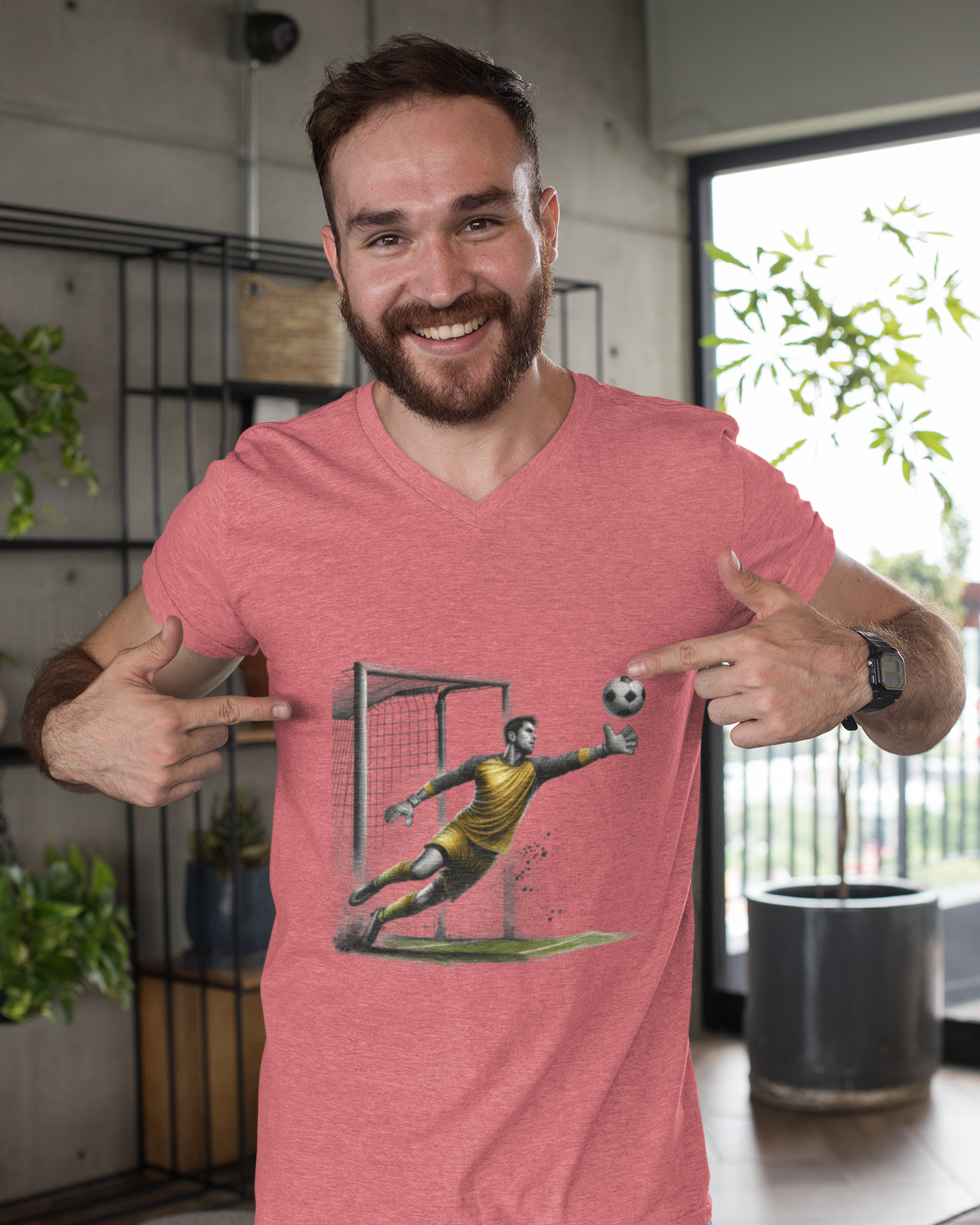 Man wearing a red t-shirt with a graphic design pointing at himself.