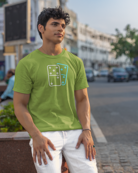 Man wearing a green t-shirt with a graphic design on a street background
