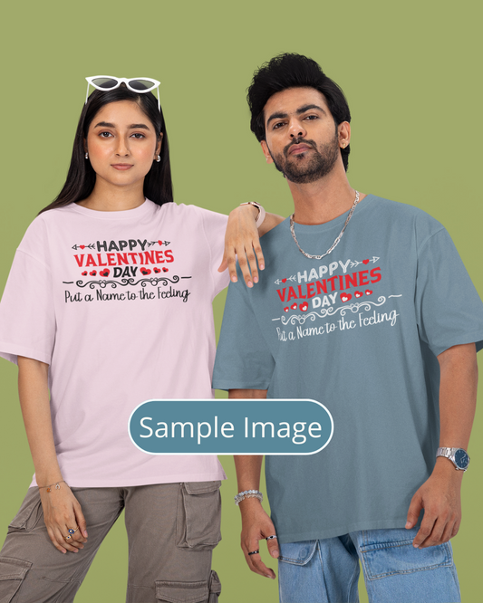 Two people wearing Valentine's Day t-shirts on a green background