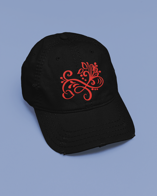 Black cap with red floral design on a blue background