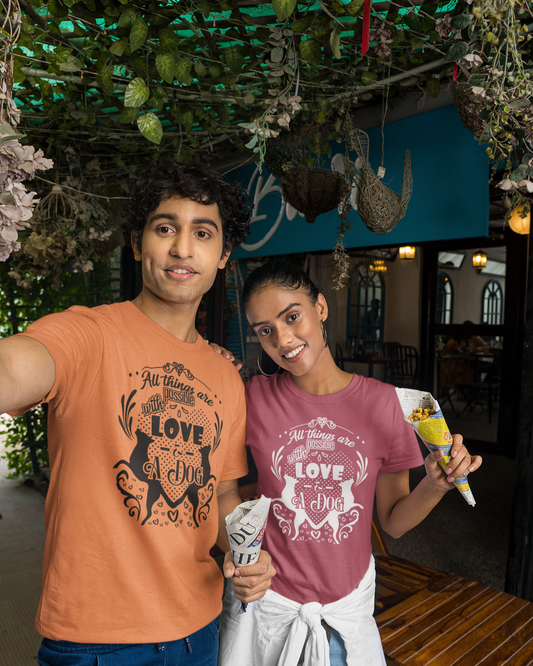 Two people standing together in an outdoor setting with a decorative background.