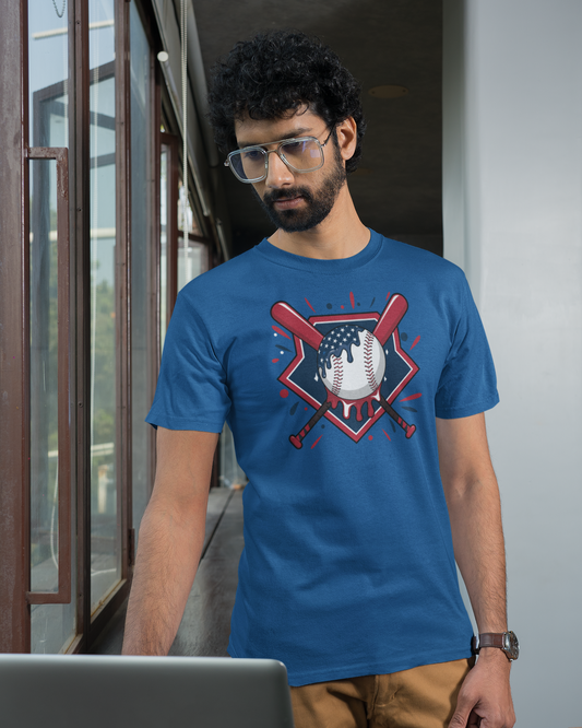 Man wearing a blue t-shirt with a graphic design, standing indoors.