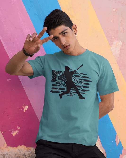 Person wearing a teal t-shirt with a graphic design against a colorful abstract background