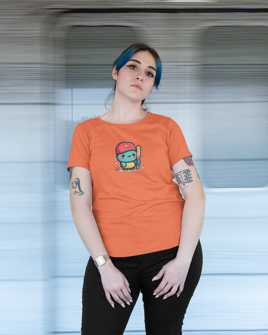 Person wearing an orange t-shirt with a graphic design, standing in front of a blurred background