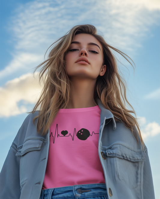 Woman wearing a pink shirt with a design against a blue sky